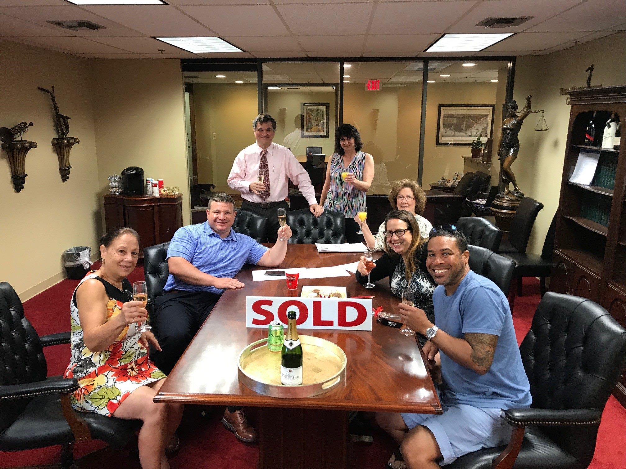 DANA BARTHELEMY, ROBERT CAGLE with LHH Mortgage clients at their closing.